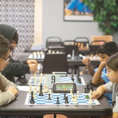 Children playing chess at chess camp
