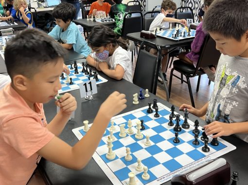 Children playing chess at chess camp